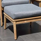 Switch Wooden chair with gray cushion on a tiled floor. 2 image