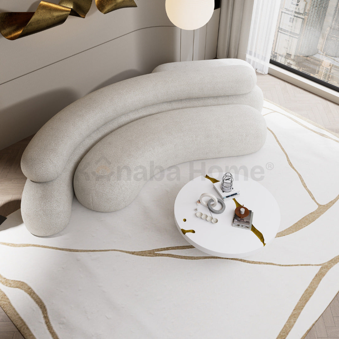 Modern interior with a curved beige sofa