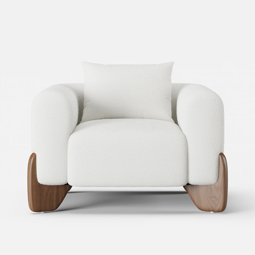 White armchair with wooden legs on a white background