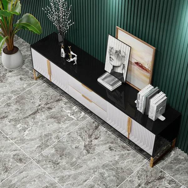 gold handles and white front of tv unit